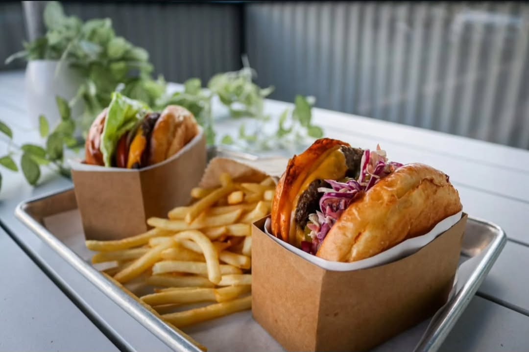 Handcrafted burgers being prepared at Hendrick's kitchen