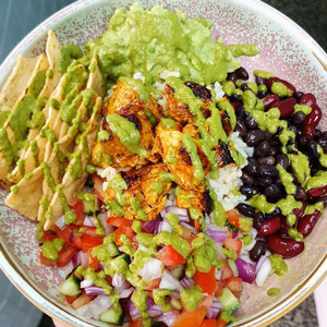 Fresh harvest bowl with poached chicken, brown rice and honey mustard dressing